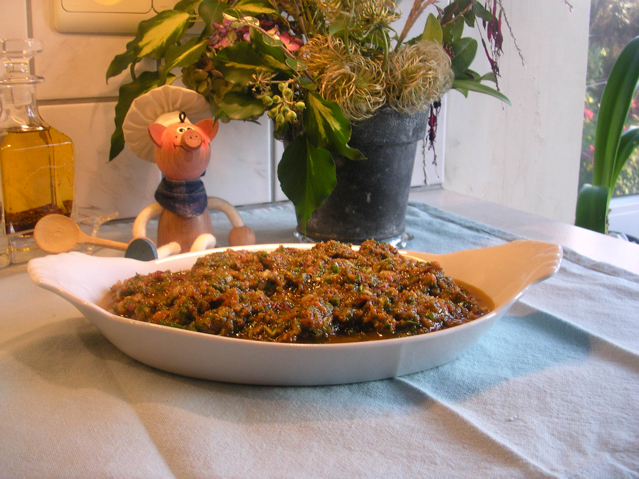 Saus : tapenade van rucola en zongedroogde tomaten