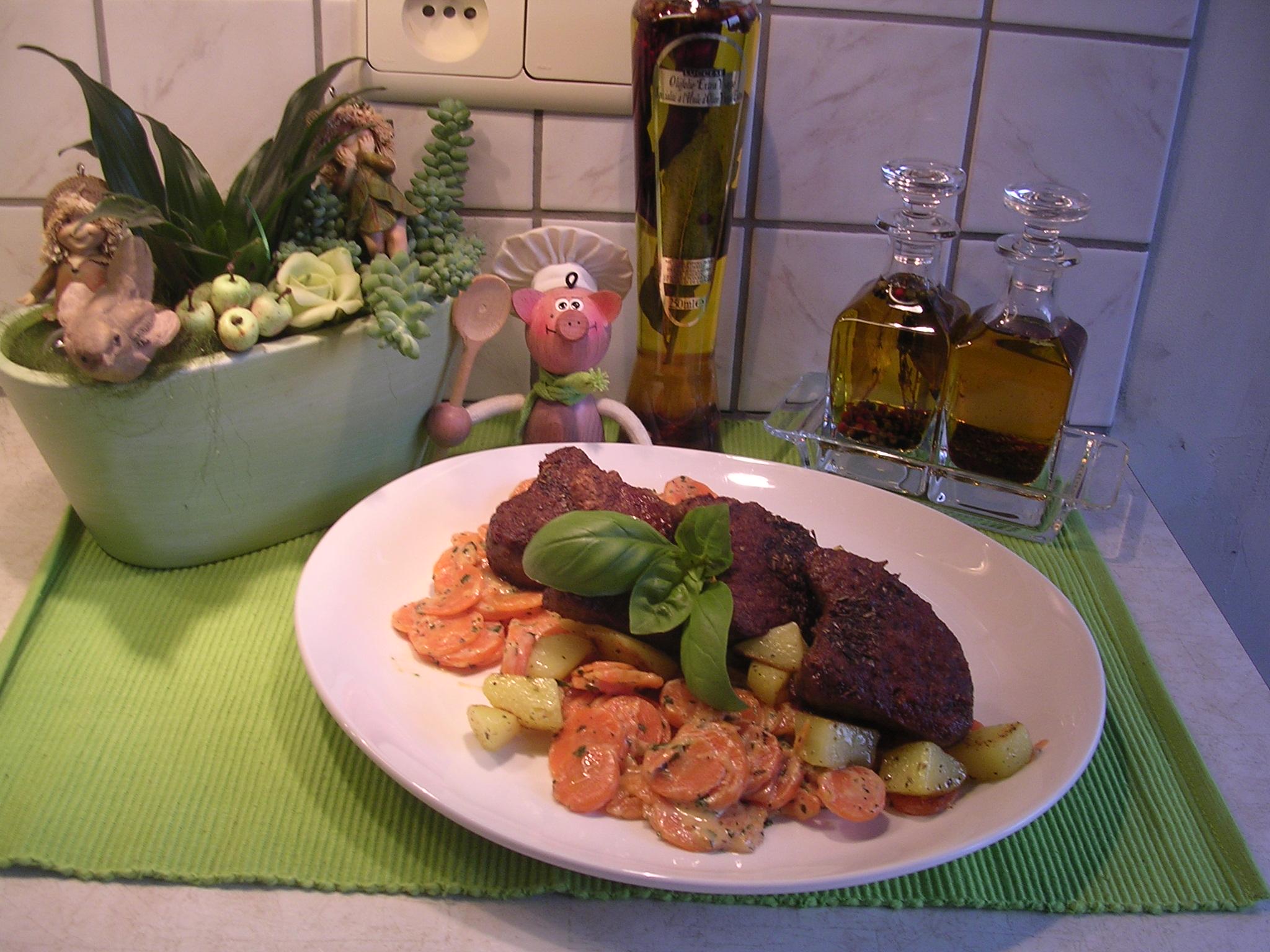 Lamsepigram met  wortelen , aardappelen en verse basilicum