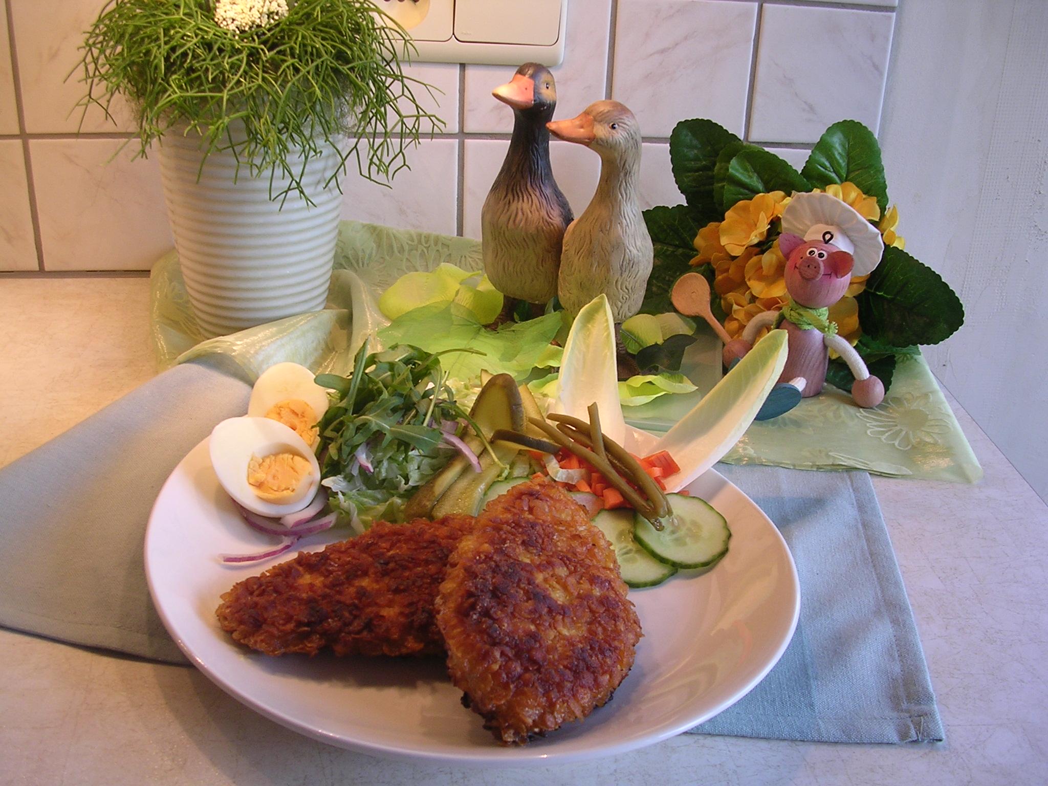 Gepaneerde kippefilets met amandelschilfers