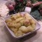 Aardappelen gewenteld in Boursin met ajuinpijpjes