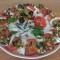 Carpaccio van tomaat, mozzarella en ansjovis