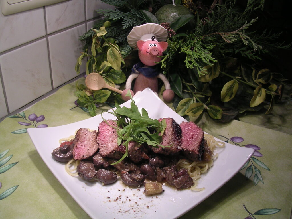 Gegrilde springbok steak met zijn garnituren