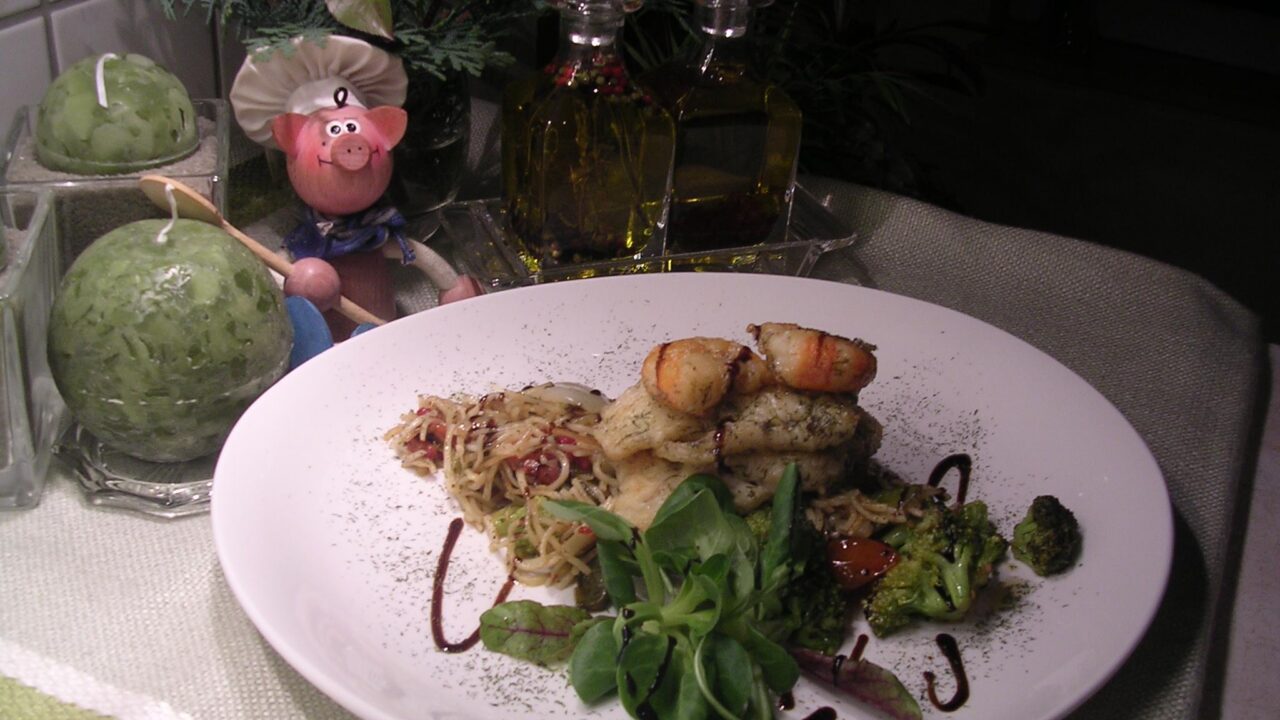 Pangasiusfilet met scampi en zijn garnituren