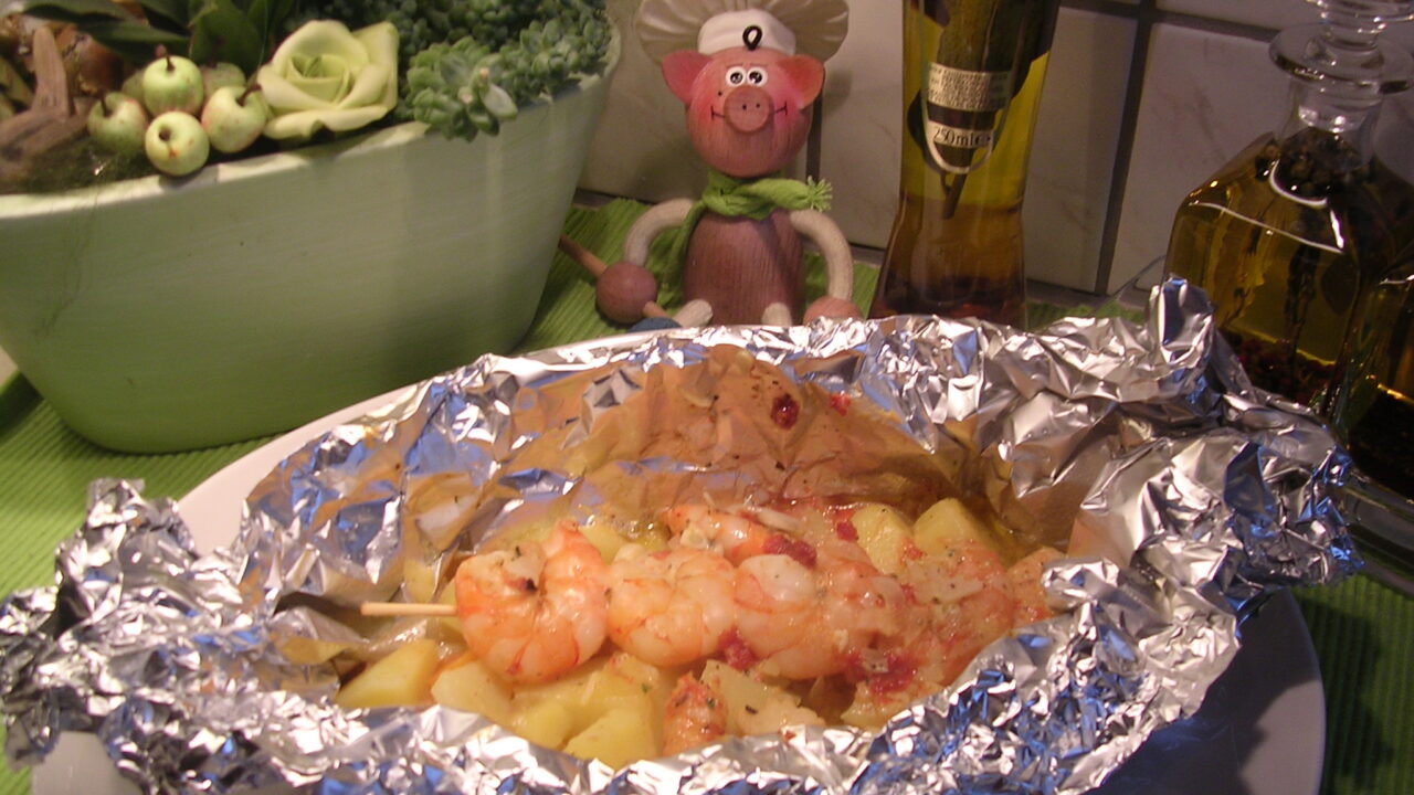 Papillote van scampi’s op een spiesje