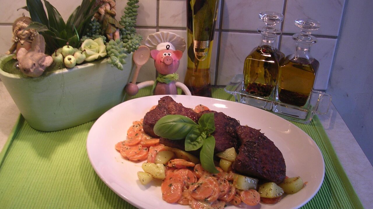 Lamsepigram met wortelen , aardappelen en verse basilicum