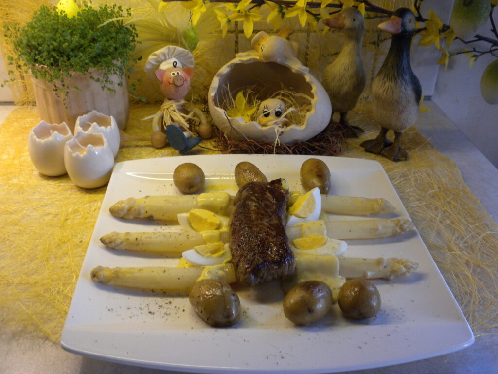 Steak vergezeld van asperges badend in bearnaise