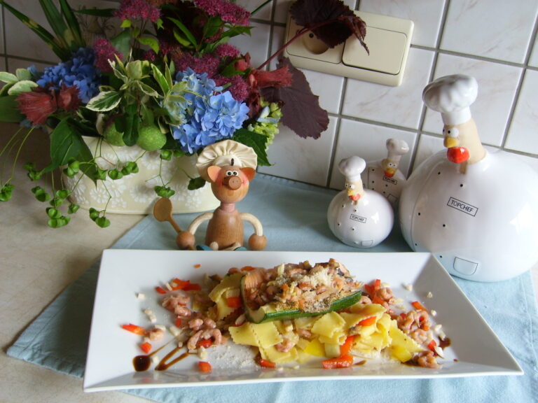 Gevulde courgette op een bedje van pasta