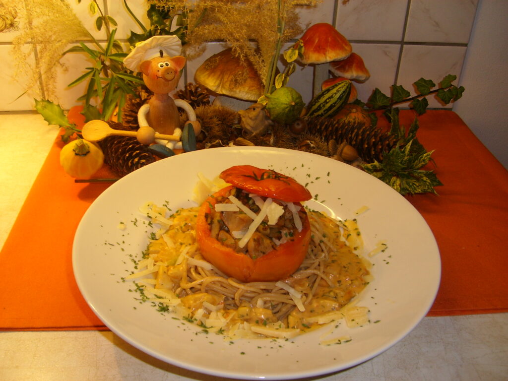 Tomaatje gevuld met fazantfilet op een bedje van volkorenpasta