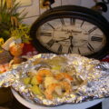 Papillotte: clams en scampi’s met currykaas