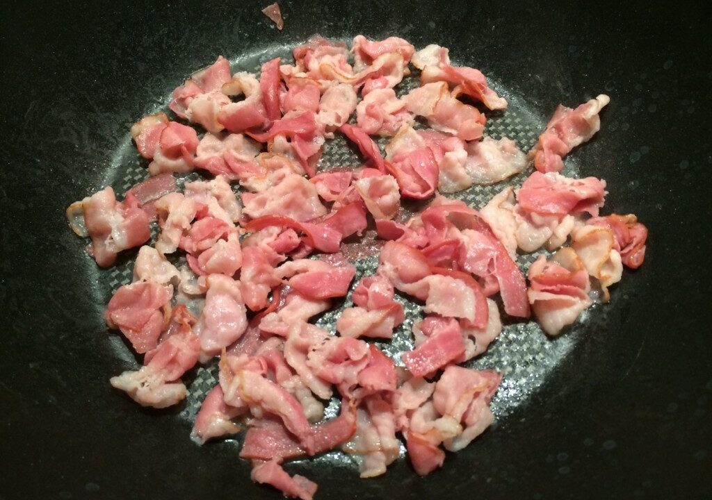 Spitskool met komijnzaad en gerookte spekreepjes