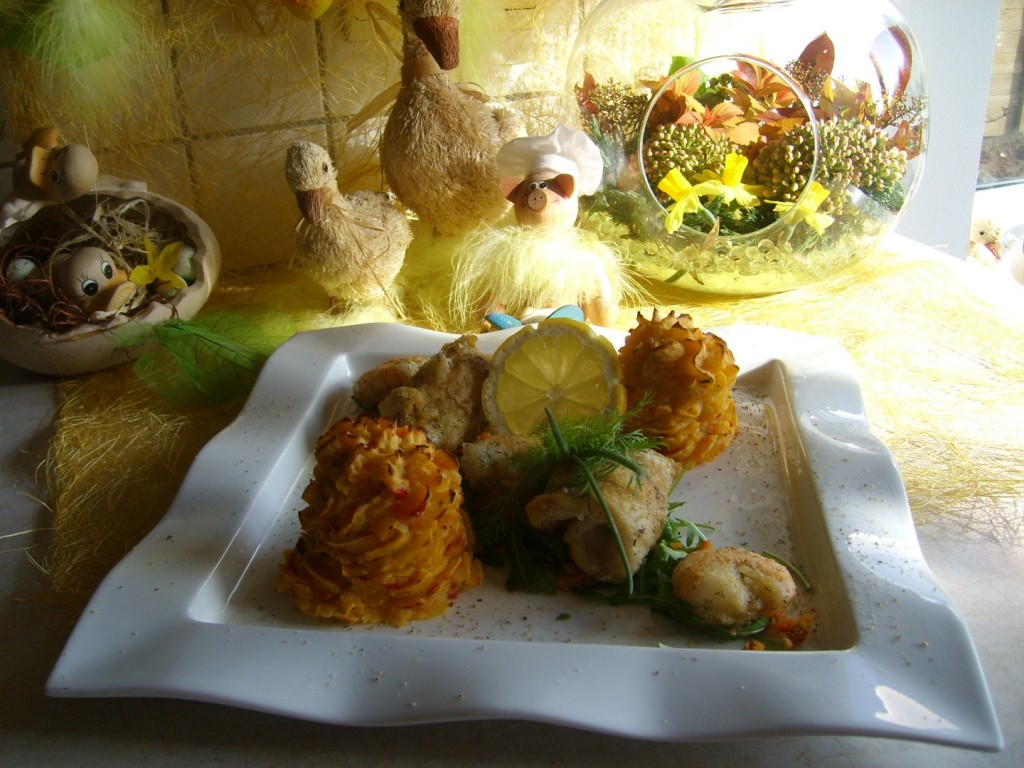 Zeetongrolletjes met scampi’s op een bedje van rucola met een verrassing van puree
