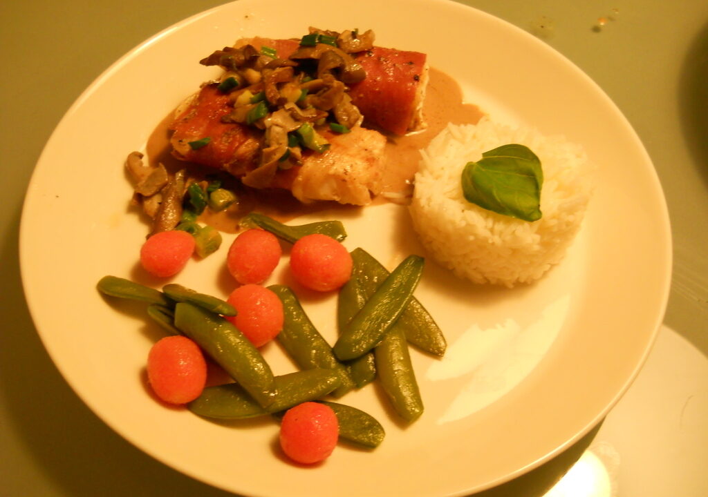 Zeewolf in Parmaham met oesterzwammen en balsamicosaus
