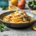 Citroen spaghetti met rucola, beenham en Grana Padano. Een snelle zomerse pasta.
