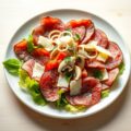 Carpaccio van rookvlees met champignons