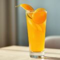 Cocktail van sinaasappel, peer en limoen