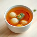 Consommè met meloenbolletjes en port