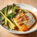 Gesmoorde asperges met snoekbaars en crumble van amandelen