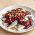 Haring met rodebietpesto