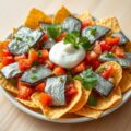 Haringhapjes met tortillachips en zure room