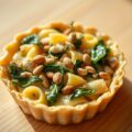 Taartje van pasta met spinazie en noten
