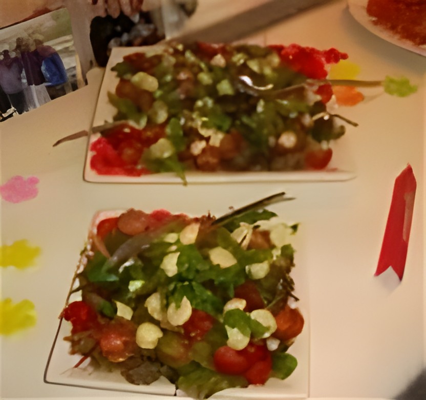 Tomatensalade van kerstomaten met gemarineerde mozzarella
