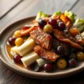 Gesmoorde witlof met buikspek en druiven