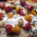 Pangasius met tomaatjes en geraspte mozzarella