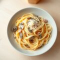 Tagliatelle met champignons en ham