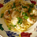 Gamba’s in citroenroomsaus op een bedje van linguine.