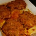 Krokante schnitzels met ham-kaaskorstje uit de oven