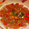 Carpaccio van rauwe ham of Parmaham met rucola en walnoten