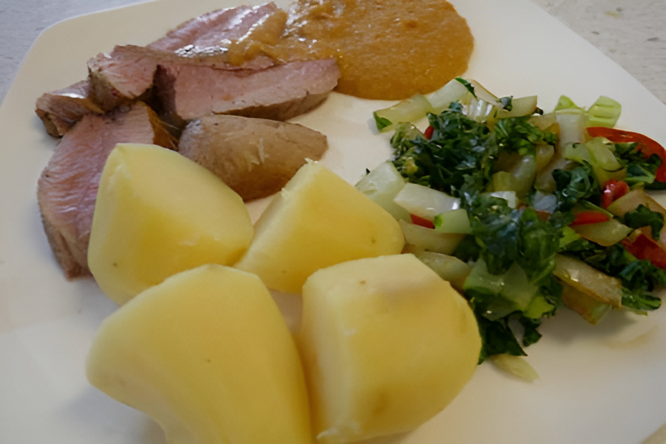 Malse varkenshaas met pittige mangosaus.
