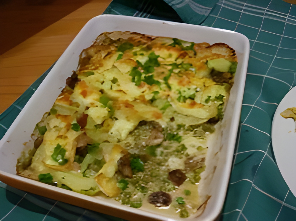 Ovenschotel met doperwten, romige champignons en brie