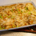 Ovenschotel met kabeljauw, champignons, lente- ui en mosterdroomsaus.