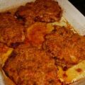 Krokante schnitzels met ham-kaaskorstje uit de oven