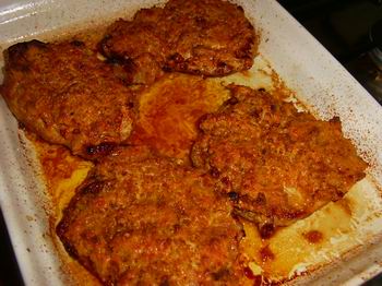 Krokante schnitzels met ham-kaaskorstje uit de oven