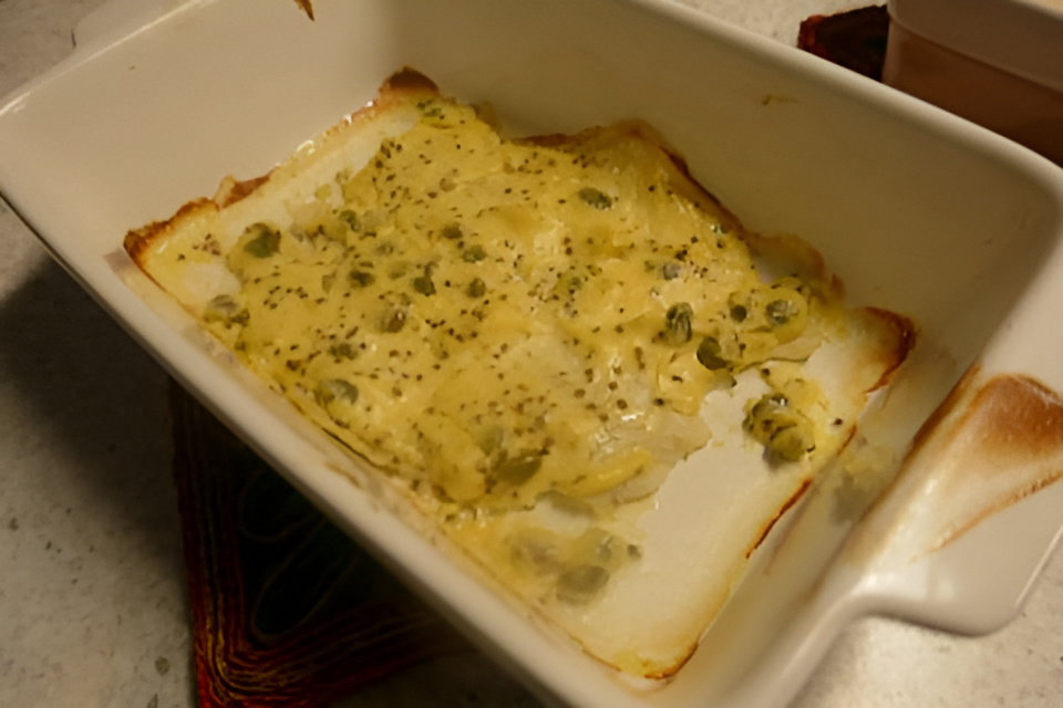 Scholletjes onder een romig dekentje uit de oven....