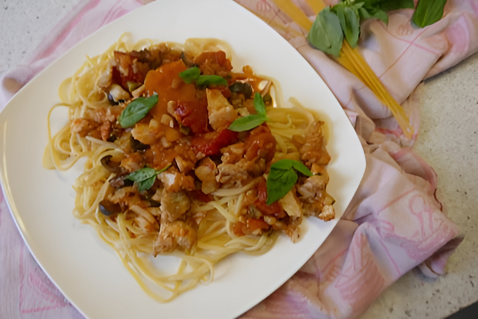 Siciliaanse kabeljauw in kruidige tomatensaus.....