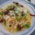 Tagiolini met citroenroom, rucola, pijnboompitjes, zontomaatjes en…